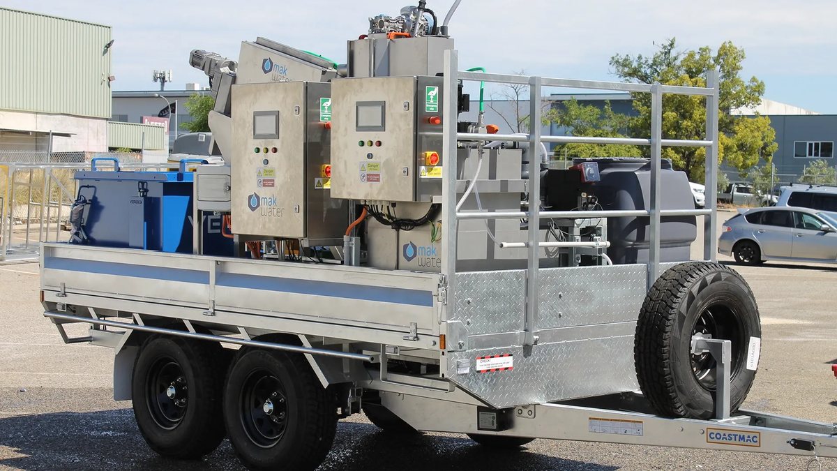 MAK Water trailer-mounted water treatment units being transported, showing containerized skids with control panels