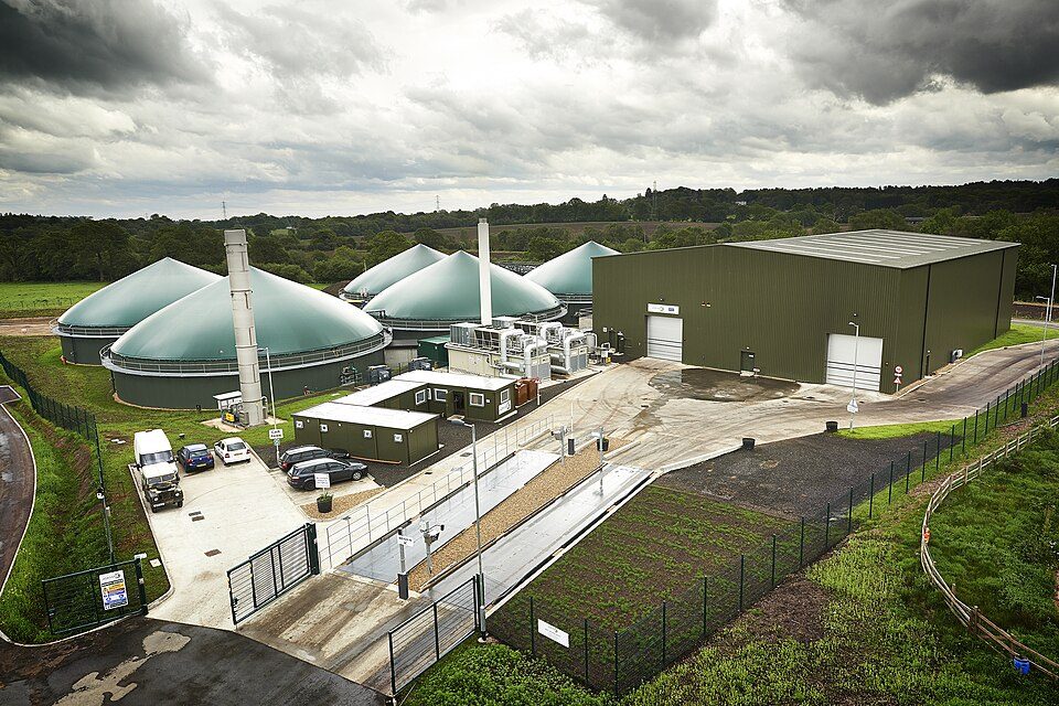 Aerial view of anaerobic digestion biogas facility with dome tanks.